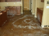 Serious water damage in spacious kitchen.